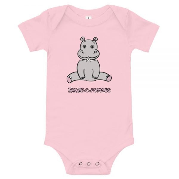 Tracheostomy Onsie in pink with an image of a cartoon hippopotamus with a tracheostomy tube